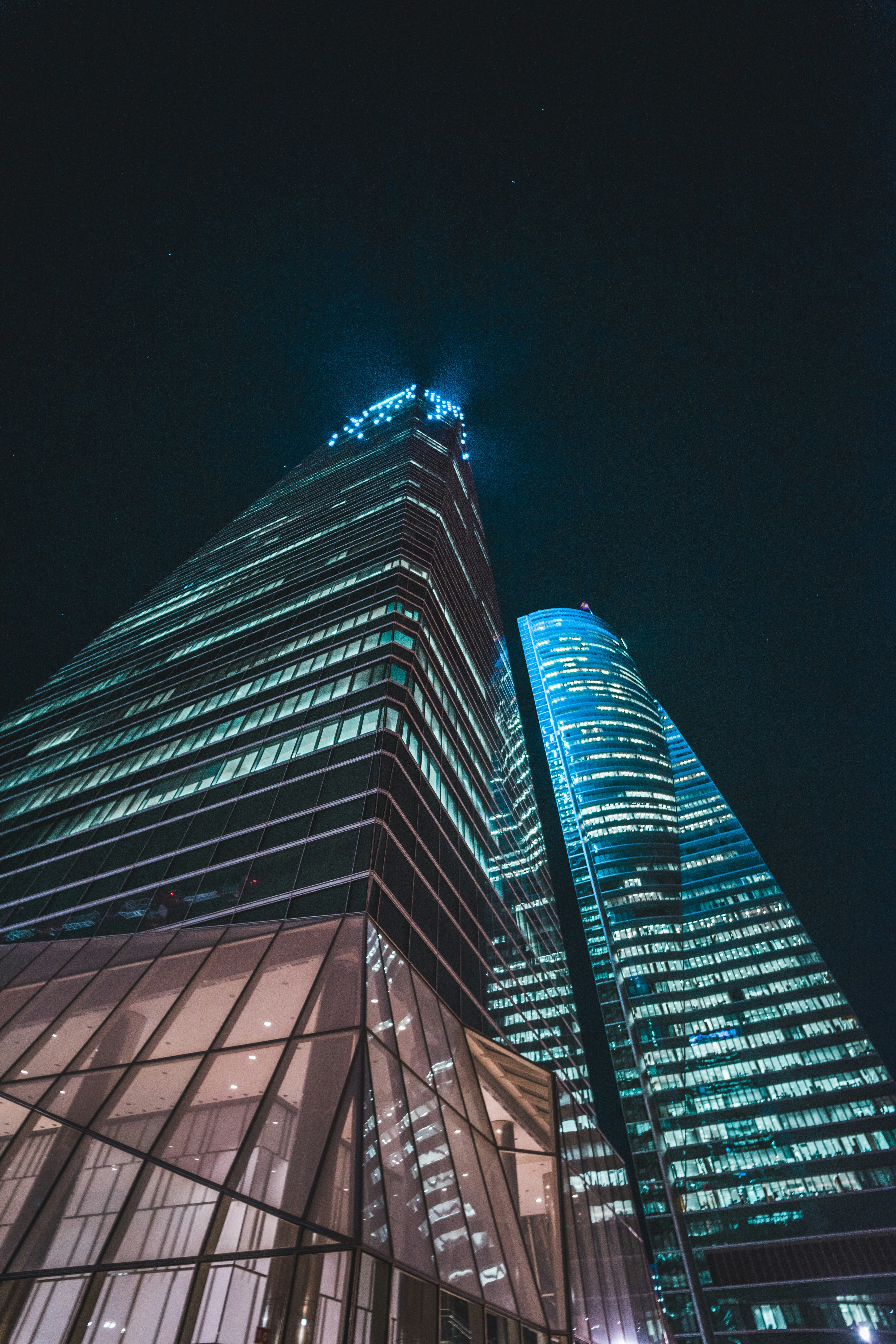 blue and black high rise building during nighttime